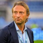 Ritratto di Flavio Ricciardella con capelli castani e giacca scura, al centro del discorso sulla salvezza del Genoa dopo Roma